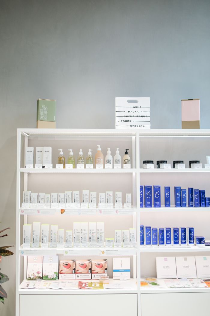 Well-organized skincare product display on shelves in a store setting.